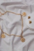 KIT Colar Dourado Pentagrama + Brinco Caveira Dourada - comprar online