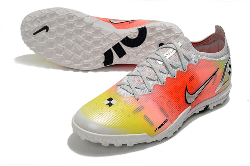 chuteira branca e laranja da nike