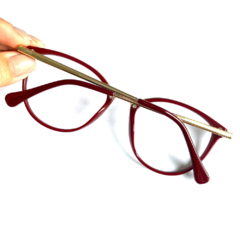Armação de óculos colorida vermelha redonda com detalhes dourado