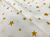 Seda Gloss Estampada Estrelas Douradas - 97% Poliéster 3% Elastano - 1,50 Metros de Largura - loja online