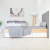 Hermosa decoración nórdica en dormitorio con cómoda, lámpara de pie y cama con cajones  | Belgrano Home

