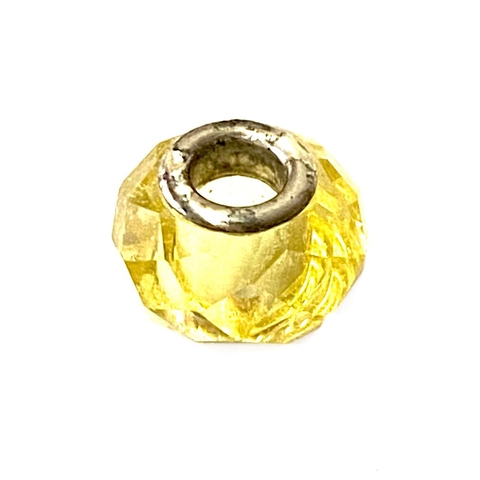 Dije dona de acero con vidrio amarillo de 1,3 cm diametro y 1 cm de alto